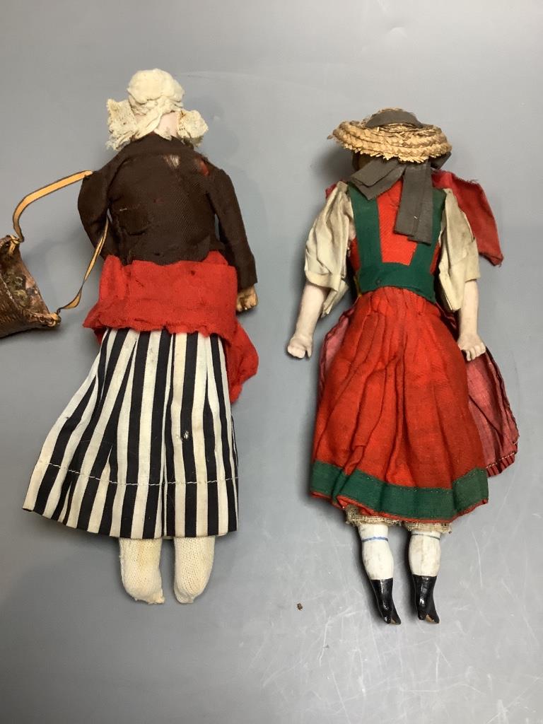 Two costume dolls, one an Oyster bisque head, height 28cm, two bisque shoulder plate/boots/hands, height 28cm